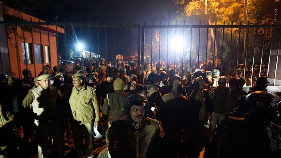 Police gather outside a gate of the Jawaharlal Nehru University (JNU) in Delhi on January 5, 2020