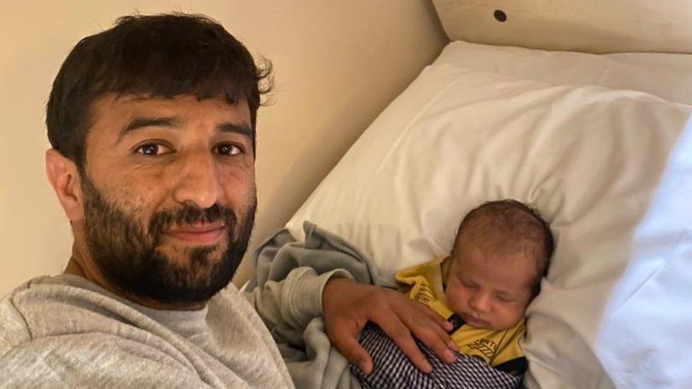 Khalid and his baby in the UK