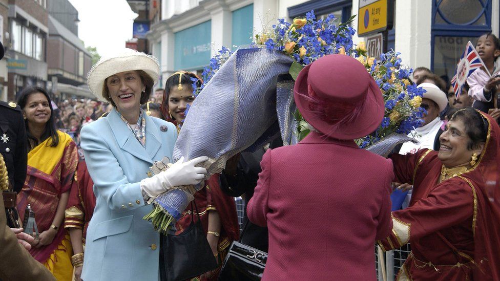 Queen Elizabeth II Laughing With Her Lady-in-waiting, Lady Susan Hussey As They Gather Bouquets Of Flowers During A Walkabout On Her Jubilee Tour.