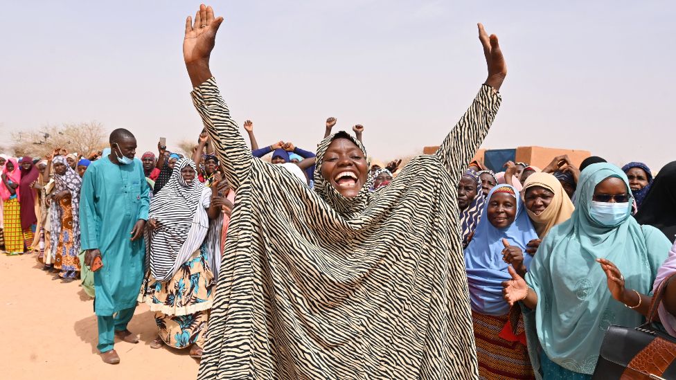 A woman raises her hands in welcome in an IDP camp in Ouallam, Niger - Tuesday 3 May 2022