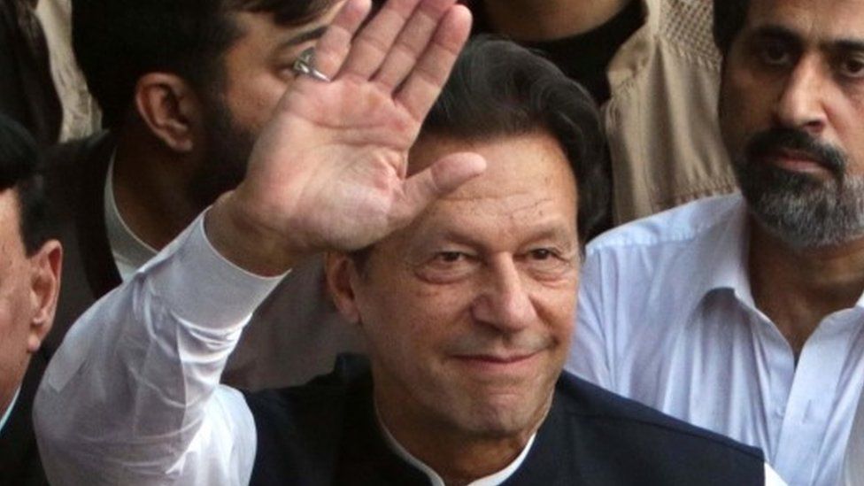 Pakistan"s former Prime Minister and current head of opposition party Pakistan Tehreek-e-Insaf (PTI), Imran Khan gestures during a march against inflation as he leads a convoy that enters Islamabad for a public gathering of his party at Parade Ground, in Rawalpindi, Pakistan, 02 July 2022.