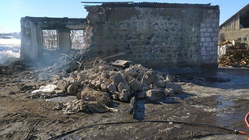 A burnt-out Armenian army barracks taken after a fire in the village of Azat, some 170kms east of Yerevan on January 19