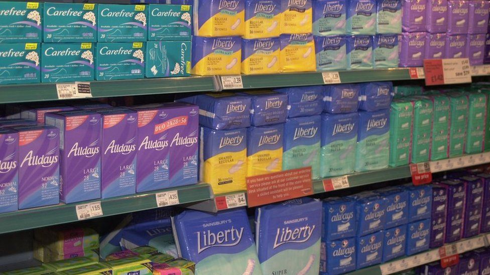 Sanitary towels on the shelf in a supermarket