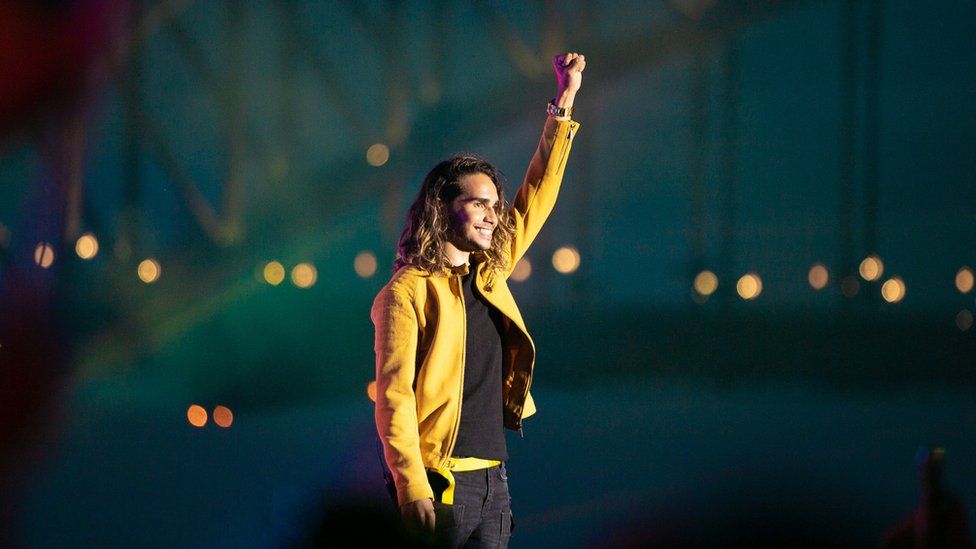 Isaiah Firebrace performs in front of Sydney Harbour Bridge