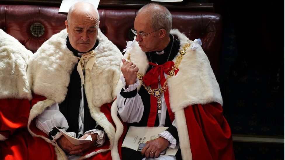 The Archbishop of Canterbury Justin Welby talking to another peer ahead of the State Opening of Parliament.