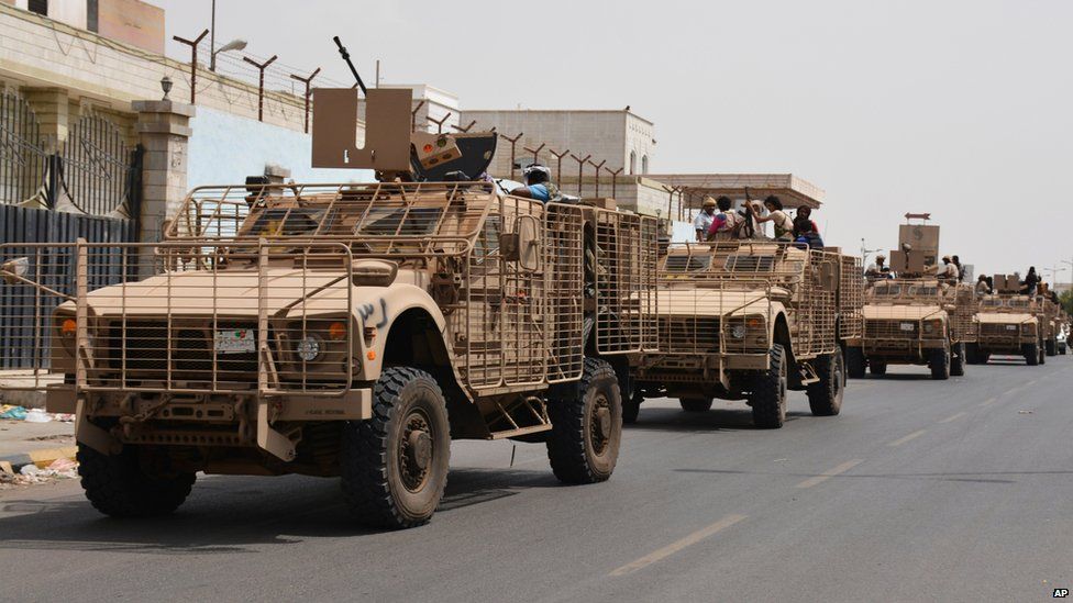 Pro-government fighters are transported in armoured vehicles through the streets of Yemen's second city of Aden (14 July 2015)