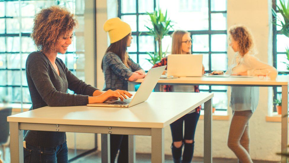 Women using standing desks