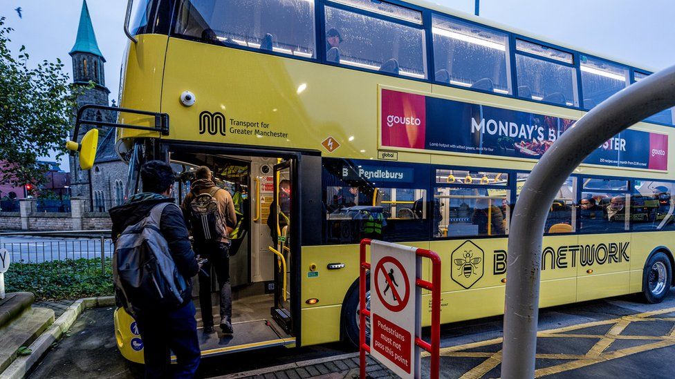 People board a Bee Network bus in Greater Manchester