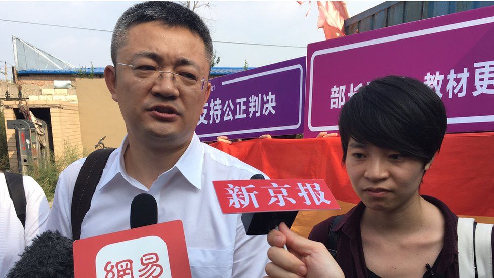 Supporter Qiu Bai and her lawyer Wang Zhenyu