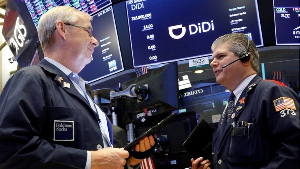 Traders work during the IPO for Chinese ride-hailing company Didi Global Inc on the New York Stock Exchange.