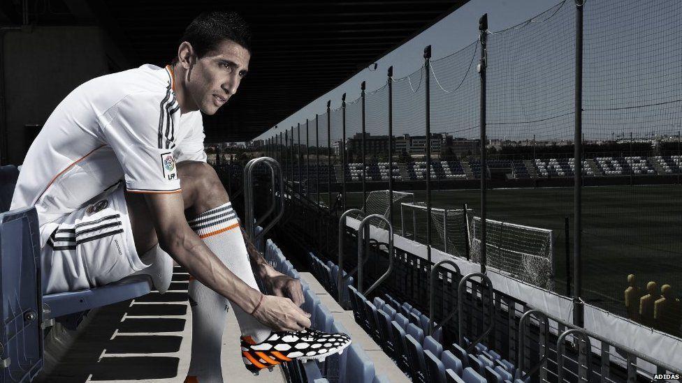 Angel Di Maria of Real Madrid tries on his adidas Predator Battle Pack boots
