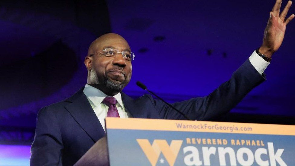 U.S. Senator Raphael Warnock (D-GA) speaks during an election night party after a projected win in the U.S. midterm runoff election