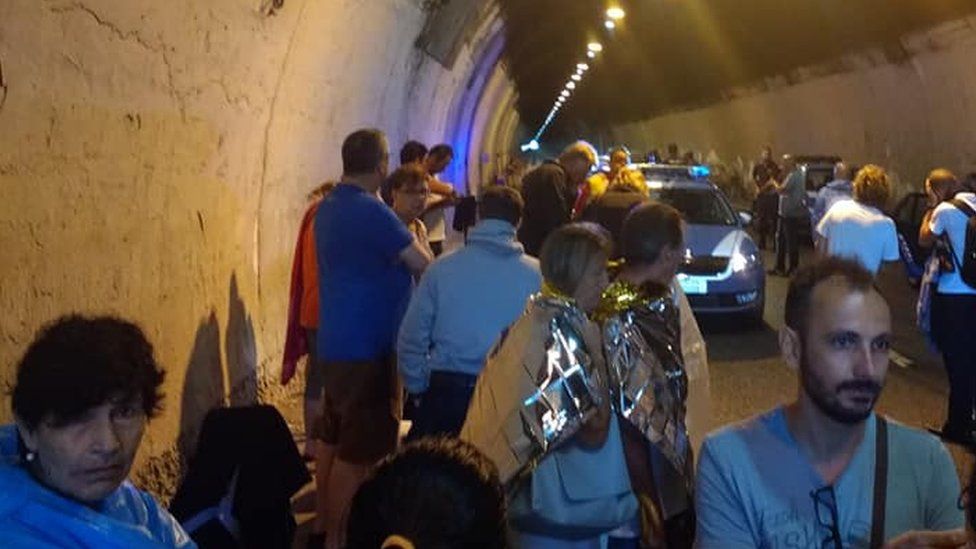 Drivers and passengers shelter in Genoa motorway tunnel