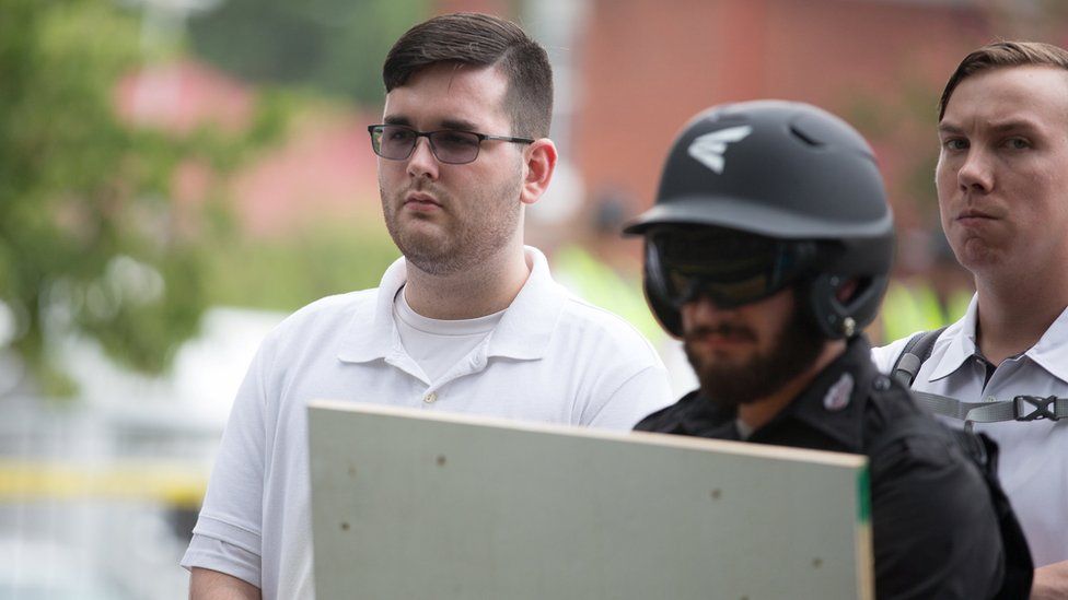 James Alex Fields Jnr pictured at "Unite the right" rally before the car attack. Standing in a white polo shirt.
