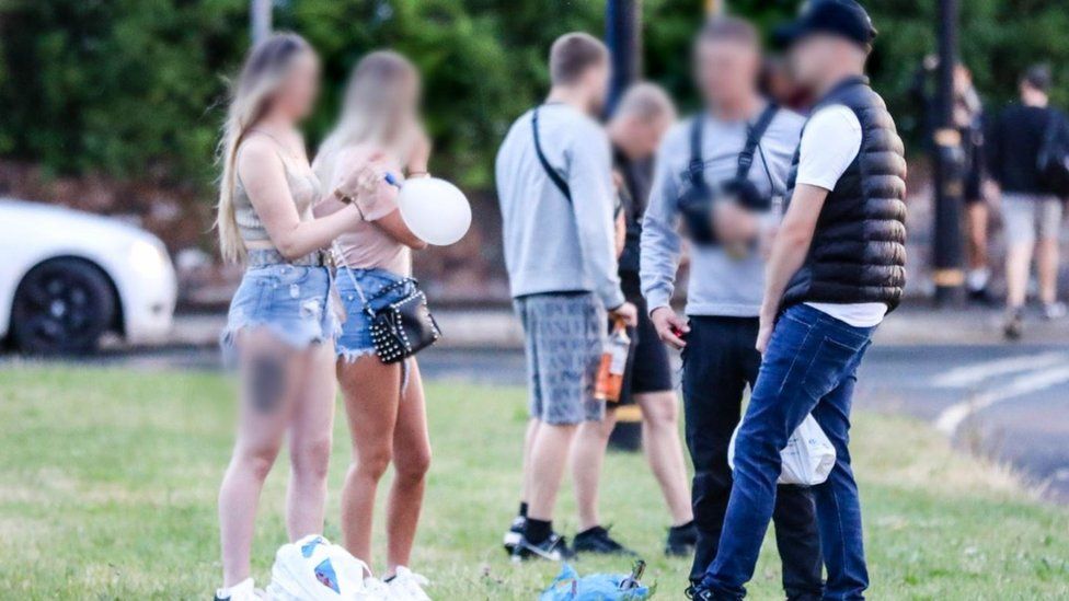 People stood together near rave site
