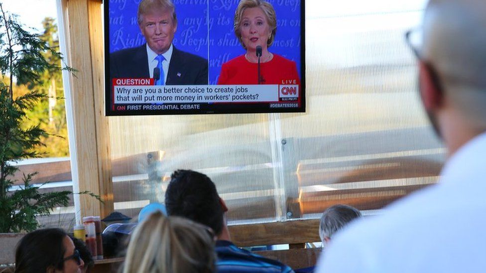 people watching Donald Trump and Hillary CLinton on split screen