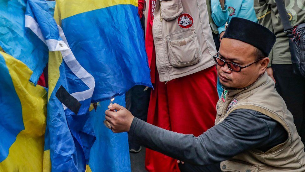 Muslim protesters burn Sweden's flag during an anti-Sweden rally outside the Swedish embassy in Jakarta, Indonesia, 30 January 2023. Hundreds of protesters staged a rally against the burning of the Quran in Sweden by the Leader of the far-right Danish political party Stram Kurs (Hard Line), Rasmus Paludan, demanding that the Swedish govenrment take actions.