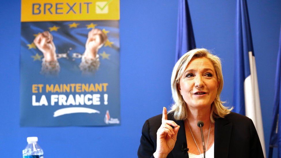 FN leader Marine Le Pen with Brexit poster saying "And now France!", 24 Jun 16