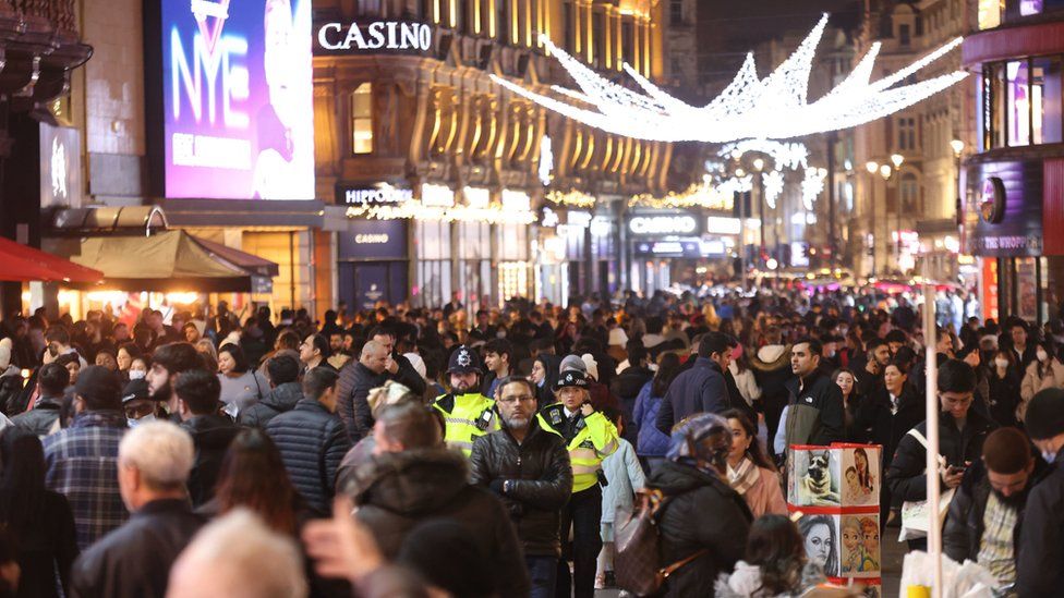 People gather in large numbers in Leicester Square, central London