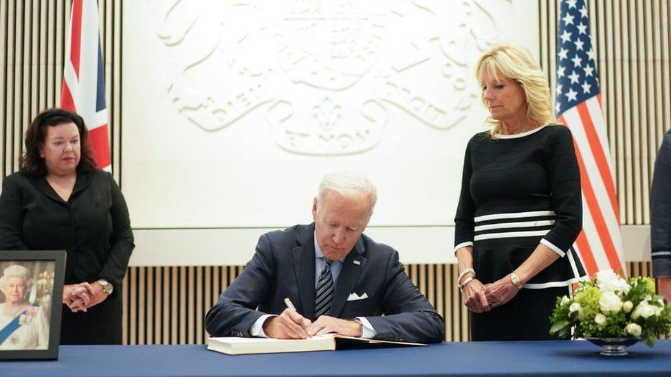 US President Biden signs a book of condolences at the British embassy in Washington DC