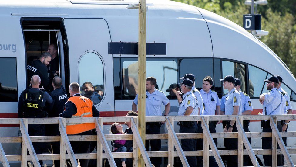 Small girl cries as she is removed by police from Danish train in Rodbyhavn (9 September)