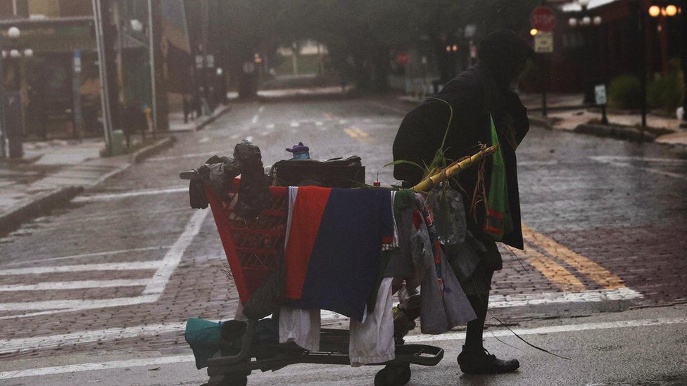 Man carries his belongings in Tampa, Florida