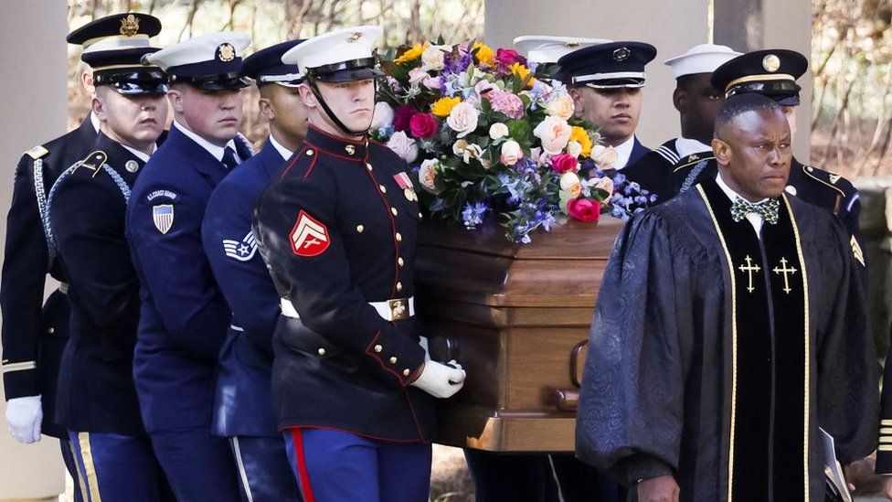 Soldiers carry Rosalynn Carter's coffin on Tuesday