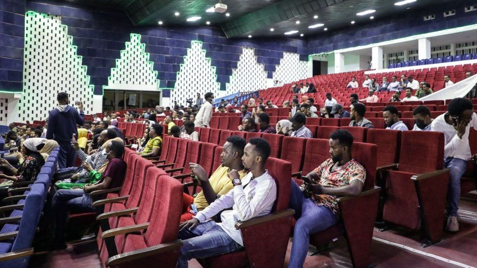 Viewers wait for the film screening at the Somali National Theatre in Mogadishu on 22 September 2021