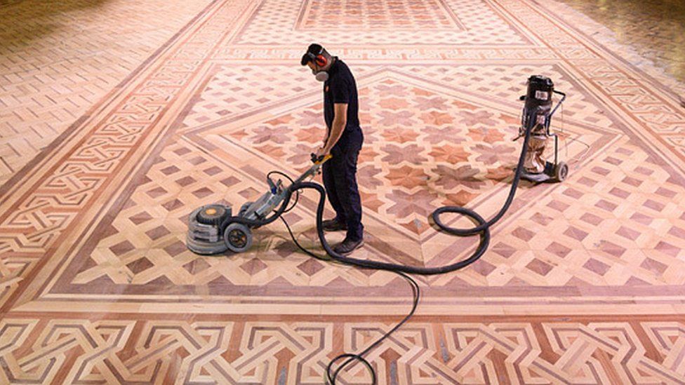 Henry Armitage, a wood sanding technician, working to restore the floor of the historic Blackpool Tower Ballroom