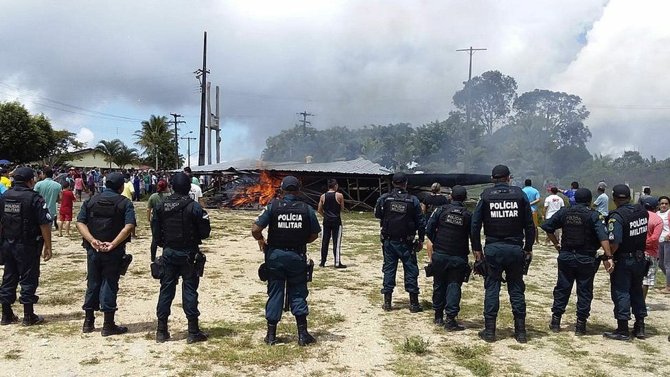 Police try to maintain control as Brazilian residents demonstrate against the presence of Venezuelan immigrants in Pacaraima, Brazil, 18 August 2018