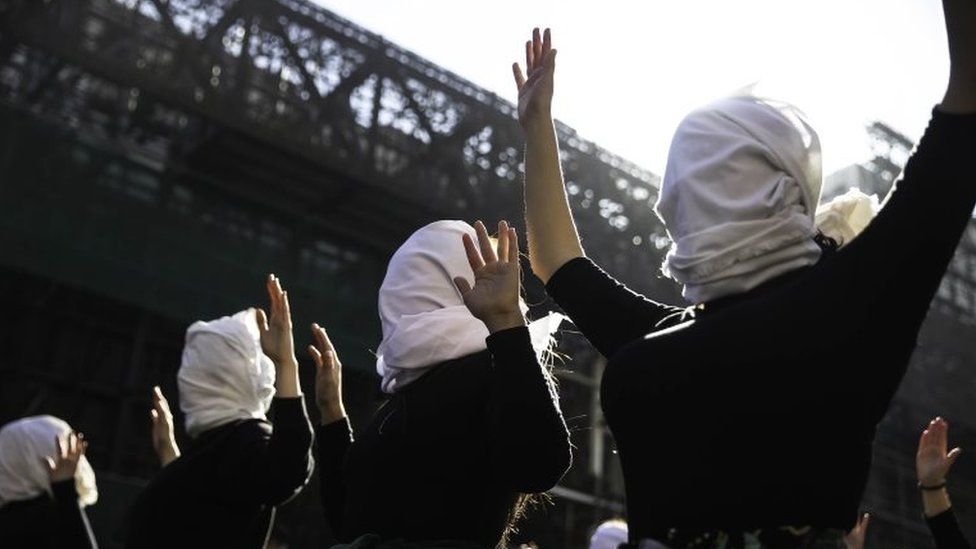 A group of women cover their faces during a demonstration in Santiago, Chile, 06 June 20