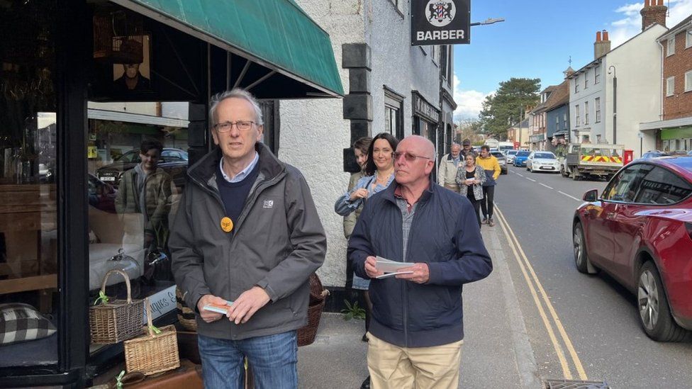 Liberal Democrats walking along a street in Brentwood