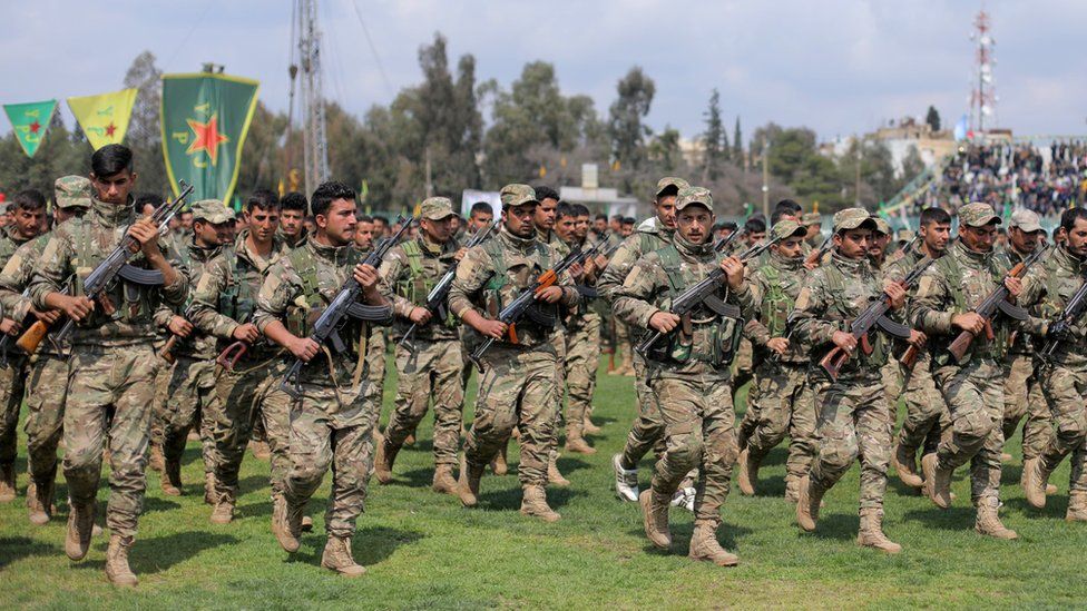 Syrian Kurdish People's Protection Units (YPG) militiamen at a parade in Qamishli on 28 March 2019