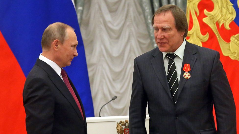 Russian President Vladimir Putin gives an order to businessman and cellist Sergei Roldugin during the state awarding ceremony at the Kremlin in Moscow, Russia, on 22 September 2016