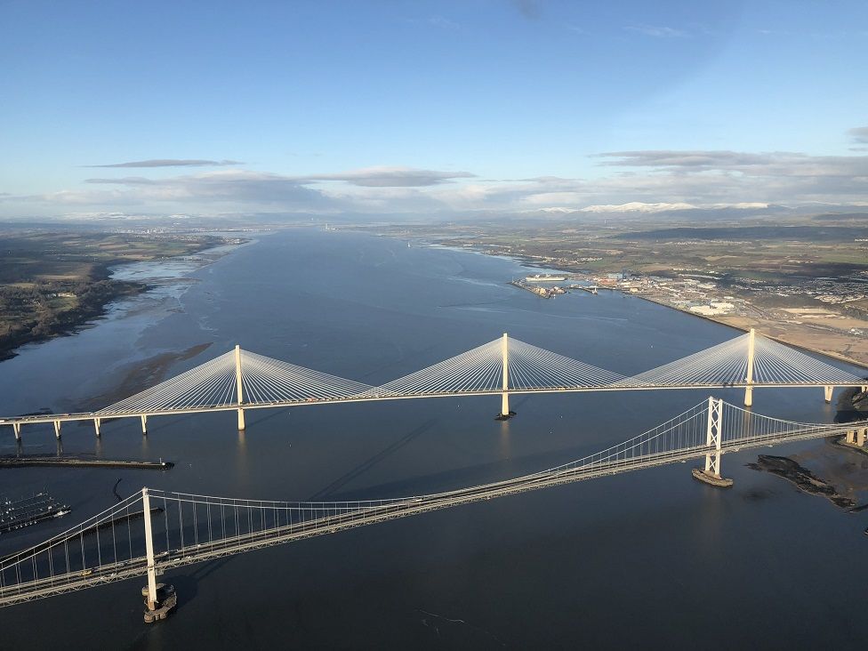 Aerial photograph of old Forth Road Bridge and Queensferry Crossing.