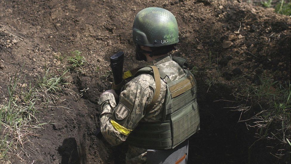 Ukrainian serviceman in a trench near Kharkiv