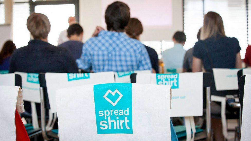 Spreadshirt T-shirts on chairs