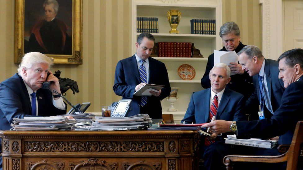 US. President Donald Trump (L-R), joined by Chief of Staff Reince Priebus, Vice President Mike Pence, senior advisor Steve Bannon, Communications Director Sean Spicer and National Security Advisor Michael Flynn, speaks by phone with Russia"s President Vladimir Putin in the Oval Office at the White House in Washington, U.S. January 28, 2017.