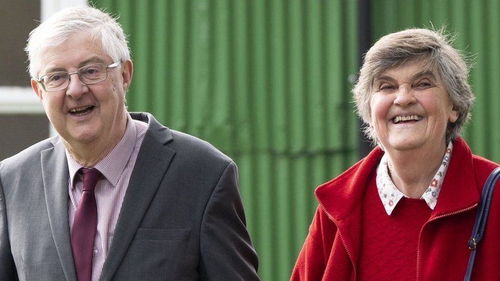 First Minister of Wales Mark Drakeford leaves the Kings Road polling station in Pontcanna with his wife Clare after voting on May 5, 2022 in Cardiff, Wales.