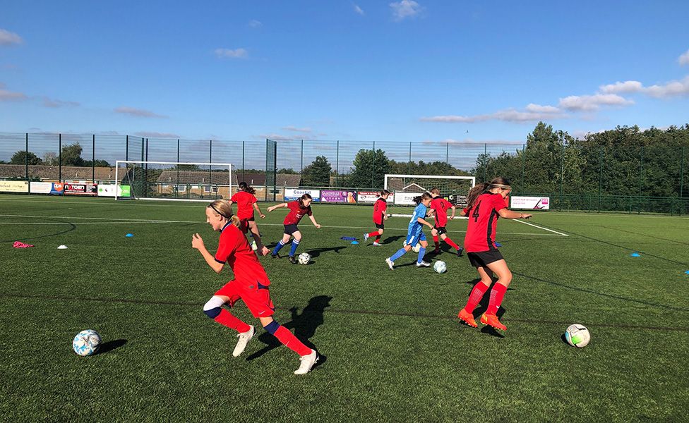 The Needham Market under-12 girls' team playing football