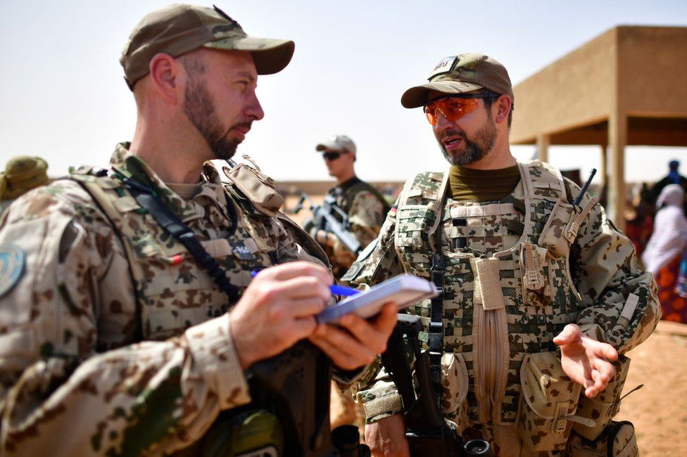 Soldiers of the Bundeswehr, the German Armed Forces gathering information about cattle prices on the outskirts of Gao, Mali on March 7, 2017