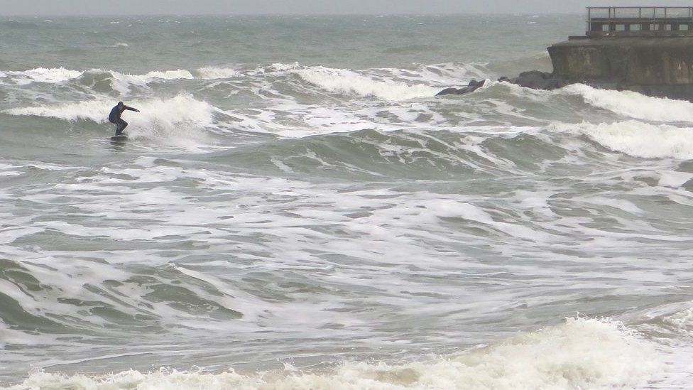 surfer at Small Hope Beach, Shanklin, in 2017