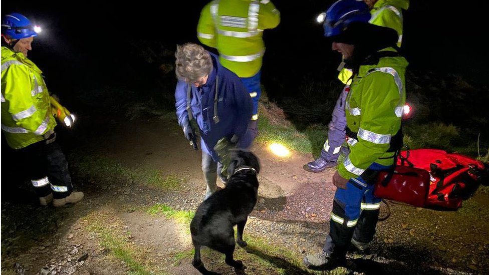 Dog with rescuers