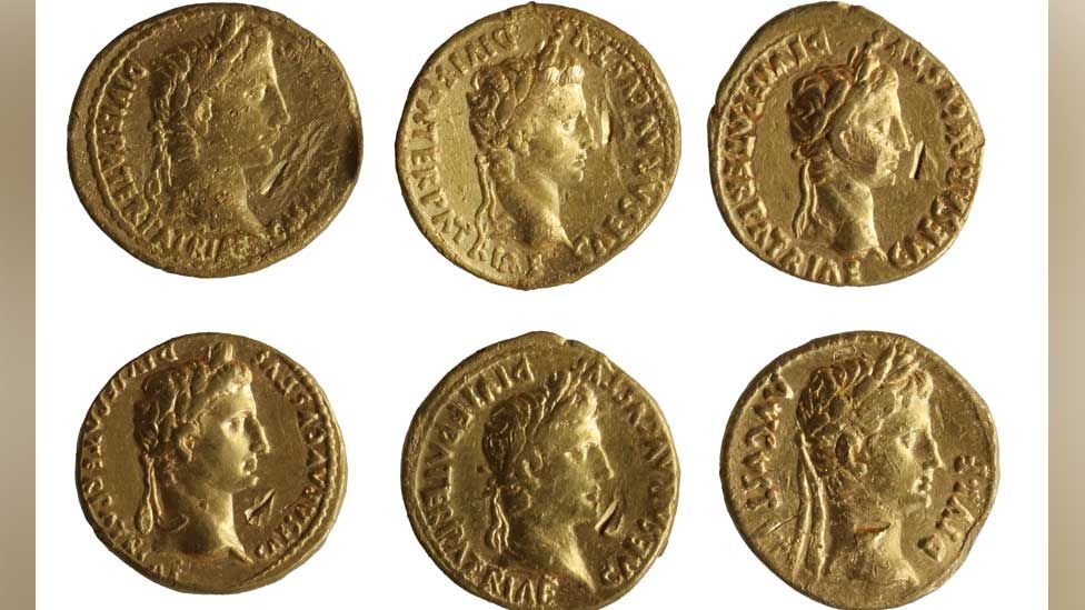 Six Roman gold coins, emperor heads
