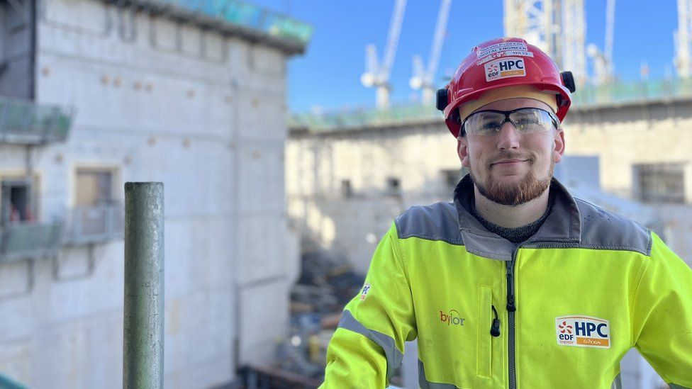 Man in PPE on nuclear power station building site