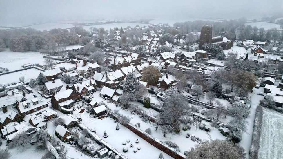 Homes in the village of Great Budworth are covered in snow after the first significant snow fall in Cheshire this Winter on December 10, 2022 in Northwich, United Kingdom