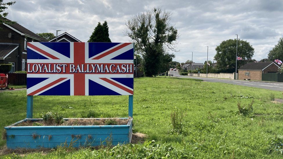 A sign painted in the design of a Union flag, with the words: LOYALIST BALLYMACASH