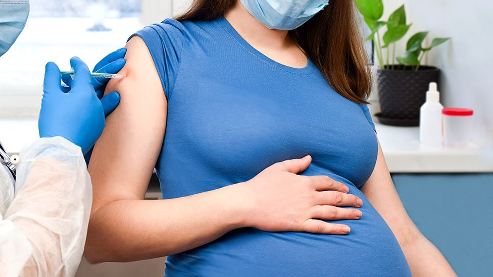 Pregnant women being vaccinated