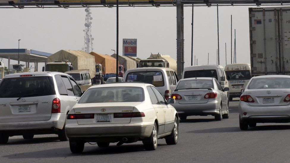 Motorists drive past a MTN billboard across Lagos-Ibadan expressway on November 15, 2015.
