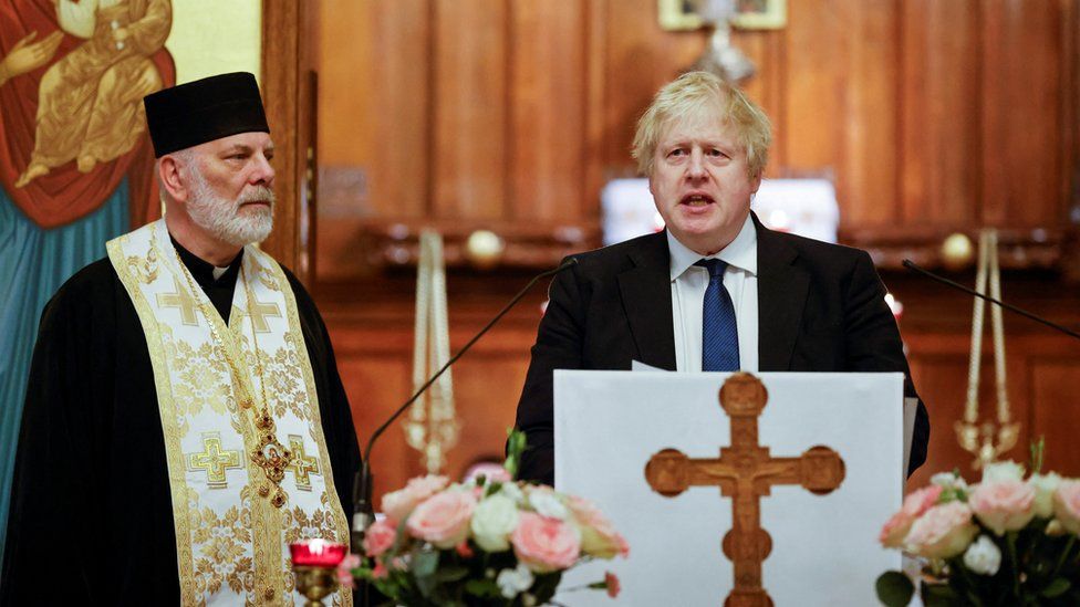 Boris Johnson seen speaking at a pulpit